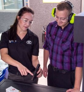 C2 Tactical | Handgun Training | Female firearm instructor helping man select the perfect firearm | Spring Break