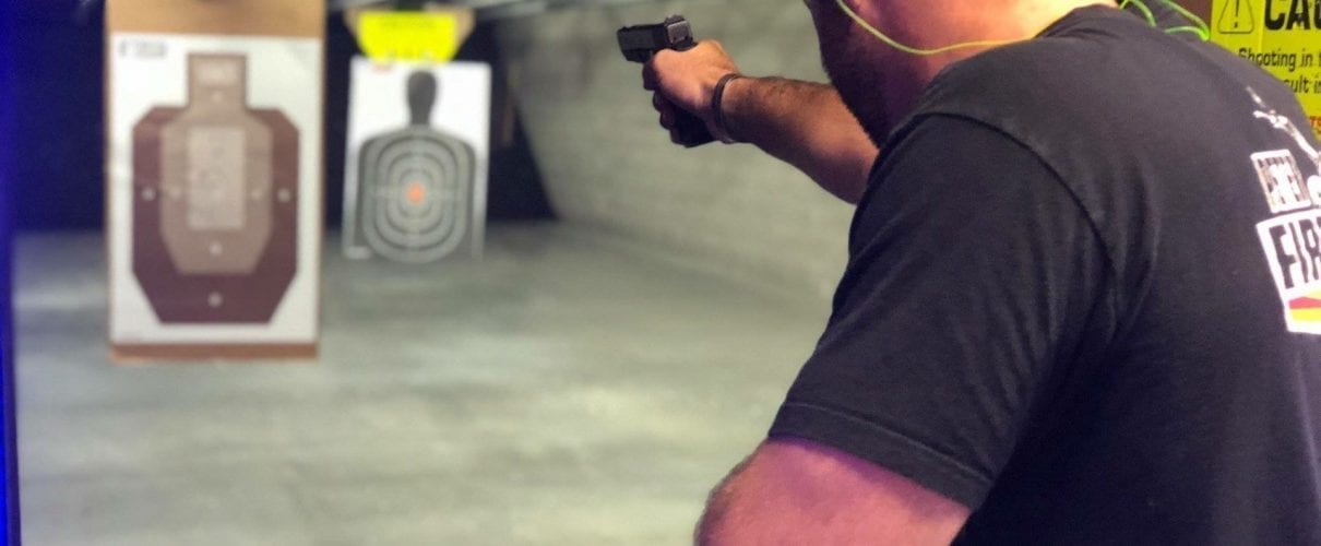 Shooting a pistol on an indoor lane at C2 Tactical